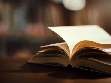 Book in library with open textbook,education learning concept